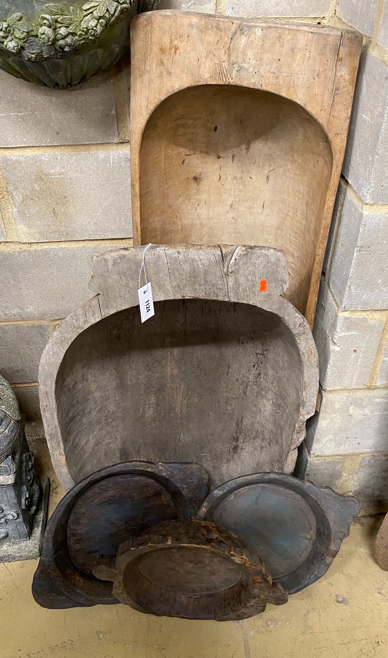 Five assorted carved wood grain bins, largest height 120cm